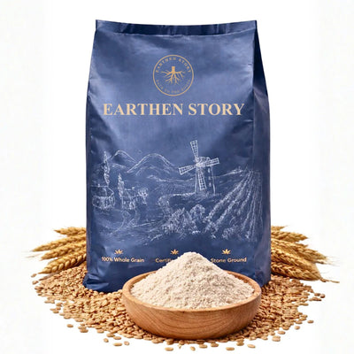 Earthen Story Khapli Wheat Atta 100% whole grain stone ground flour in blue kraft pouch with wheat grains and wooden bowl