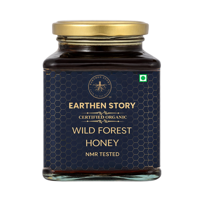 Jar of Earthen Story Wild Forest Honey on a white background