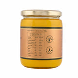 A2 Gir Cow Ghee in glass jar with gold lid, showing nutrient facts label and no adulterants badge