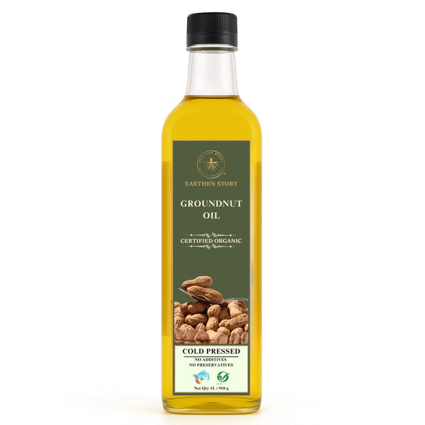 Earthen Story Certified Organic Cold Pressed Groundnut Oil in a clear glass bottle with green label