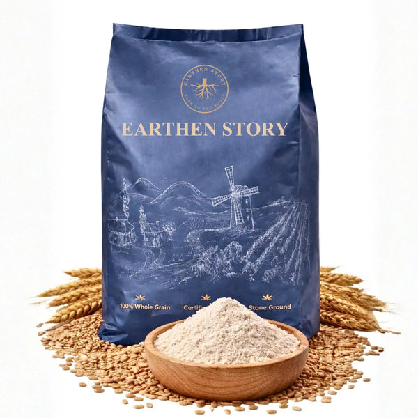 Earthen Story Khapli Wheat Atta 100% whole grain stone ground flour in blue kraft pouch with wheat grains and wooden bowl