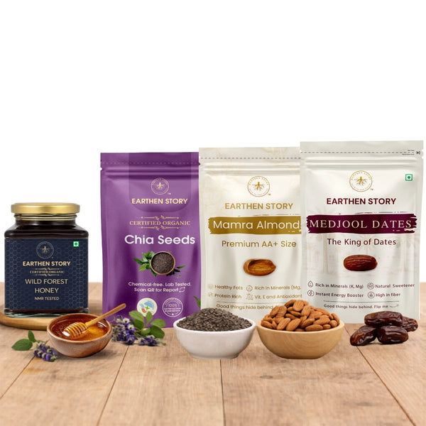 Morning Ritual Bundle with wild forest honey, chia seeds, mamra almonds, and medjool dates on a plain white background on a wooden desk.